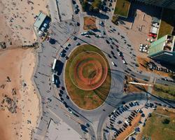 A photo of a roundabout near what looks like a beach